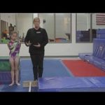 Gymnastics Tips and Exercises : How to Teach a Cast Handstand on the Bars in Gymnastics